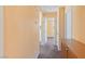 Hallway view showing access to various rooms, carpet flooring, and neutral-toned walls at 8448 Quarentina Ave, Las Vegas, NV 89149