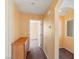 Hallway with wood cabinet and view of a bedroom and bonus room at 8448 Quarentina Ave, Las Vegas, NV 89149