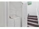 Bright laundry room with white washer and dryer, wire shelving, and natural light from a window at 8448 Quarentina Ave, Las Vegas, NV 89149