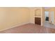 Bright living room featuring wood laminate floors, built-in niche and storage, creating a welcoming atmosphere at 8448 Quarentina Ave, Las Vegas, NV 89149