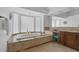 Sunlit bathroom featuring a soaking tub with decorative tile surround and vanity area with lots of light at 8825 Rozetta Ct, Las Vegas, NV 89134