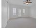 Neutral bedroom with plantation shutters on a set of french doors and large closet with bright, natural light at 8825 Rozetta Ct, Las Vegas, NV 89134