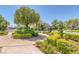 Beautifully landscaped community park with mature trees, flowering bushes, and walking paths for residents to enjoy at 8825 Rozetta Ct, Las Vegas, NV 89134