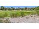 Scenic view of the golf course with manicured greens, sand traps, and mature trees in a residential community at 8825 Rozetta Ct, Las Vegas, NV 89134