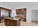 Spacious kitchen with stainless appliances, center island cooktop, and granite countertops at 8825 Rozetta Ct, Las Vegas, NV 89134