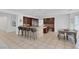 Open kitchen featuring a breakfast bar, stainless steel appliances, and tile flooring at 8825 Rozetta Ct, Las Vegas, NV 89134