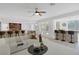Open living space features a bar and access to the backyard patio at 8825 Rozetta Ct, Las Vegas, NV 89134