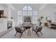 Open living area with fireplace, vaulted ceilings, modern decor, and plenty of natural light at 8825 Rozetta Ct, Las Vegas, NV 89134