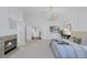 Bright main bedroom boasts a fireplace, vaulted ceiling, and a luxurious king-size bed with neutral tones at 8825 Rozetta Ct, Las Vegas, NV 89134