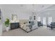 Main bedroom features a chandelier, sitting area, backyard access, and shutters at 8825 Rozetta Ct, Las Vegas, NV 89134
