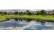 Picturesque pond on the golf course, reflecting the sky and surrounding landscape in a peaceful community setting at 8825 Rozetta Ct, Las Vegas, NV 89134