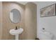 Contemporary powder room with designer finishes, vessel sink, and decorative mirror at 8825 Rozetta Ct, Las Vegas, NV 89134