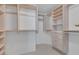 Spacious walk-in closet with custom shelving and drawers, offering ample storage space for clothes and accessories at 8825 Rozetta Ct, Las Vegas, NV 89134