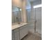 Bathroom features white vanity with a sink, an extra wide mirror, and large shower at 901 Heritage Bend Dr, Las Vegas, NV 89138