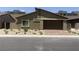 Well-maintained single-Gathering home with desert landscaping and a brick-paved driveway at 901 Heritage Bend Dr, Las Vegas, NV 89138