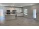 Bright, open-concept kitchen with white cabinets, stainless steel appliances, and a large island at 901 Heritage Bend Dr, Las Vegas, NV 89138