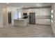 Spacious kitchen with white cabinets, stainless steel appliances, and large center island at 901 Heritage Bend Dr, Las Vegas, NV 89138