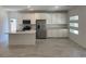 Modern kitchen featuring white cabinetry, a spacious island, and stainless steel appliances at 901 Heritage Bend Dr, Las Vegas, NV 89138