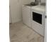 Laundry room features new, front-loading, white washer and dryer at 901 Heritage Bend Dr, Las Vegas, NV 89138