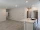 Open-concept living room with tile flooring adjacent to the kitchen at 901 Heritage Bend Dr, Las Vegas, NV 89138