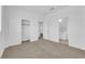 Bright bedroom with neutral carpet, white walls, closet and two doorways at 9500 Catalina Cove Cir, Las Vegas, NV 89147