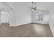 Bright bedroom with wood floors and white trim features ample natural light at 9500 Catalina Cove Cir, Las Vegas, NV 89147