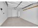 Clean, empty garage with white walls and ample space for parking and storage at 9500 Catalina Cove Cir, Las Vegas, NV 89147