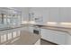 Bright kitchen featuring quartz countertops, white cabinetry, and stainless steel appliances at 9500 Catalina Cove Cir, Las Vegas, NV 89147