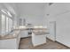 Bright kitchen with white cabinets, quartz countertops, and stainless steel appliances at 9500 Catalina Cove Cir, Las Vegas, NV 89147