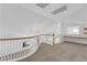 Carpeted upstairs landing with a sitting nook and clerestory window at 9500 Catalina Cove Cir, Las Vegas, NV 89147