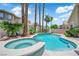 Sparkling pool and spa with lush tropical landscaping in a private backyard setting at 9500 Catalina Cove Cir, Las Vegas, NV 89147
