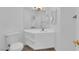 Powder room with white vanity and modern fixtures at 9500 Catalina Cove Cir, Las Vegas, NV 89147