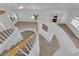 Elegant curved staircase with wood railing and ample natural light in a modern home at 9500 Catalina Cove Cir, Las Vegas, NV 89147