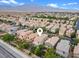 Aerial view of the home in a neighborhood with mountains in the distance at 9709 Fast Elk St, Las Vegas, NV 89143