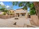 A spacious backyard with a stone patio and fire pit at 9709 Fast Elk St, Las Vegas, NV 89143