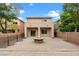 Backyard with a paved patio and fire pit, perfect for outdoor entertaining at 9709 Fast Elk St, Las Vegas, NV 89143
