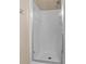 Bathroom with a glass framed standing shower with a white tiled wall at 9709 Fast Elk St, Las Vegas, NV 89143