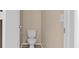 Powder room featuring neutral walls, a toilet and access doors at 9709 Fast Elk St, Las Vegas, NV 89143