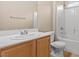 Bathroom with a single sink vanity, toilet, and tub/shower combo at 9709 Fast Elk St, Las Vegas, NV 89143