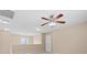 Bedroom featuring neutral walls, ceiling fan with lighting and access door at 9709 Fast Elk St, Las Vegas, NV 89143