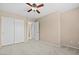 Bedroom features carpet, neutral walls, ceiling fan, and closet at 9709 Fast Elk St, Las Vegas, NV 89143