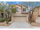 Charming two-story home featuring a neutral color palette, well-maintained landscaping, and an attached two-car garage at 9709 Fast Elk St, Las Vegas, NV 89143