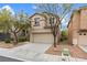Charming two-story home with a two-car garage and landscaped front yard at 9709 Fast Elk St, Las Vegas, NV 89143