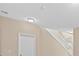Hallway with natural light, white staircase, and recessed lighting at 9709 Fast Elk St, Las Vegas, NV 89143
