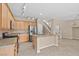 Spacious kitchen features granite countertops, stainless steel appliances, and an island with sink, perfect for modern living at 9709 Fast Elk St, Las Vegas, NV 89143