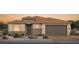 Beautiful one story home with a two-car garage, neutral colors and stone accents at 10266 Rosemont Hills St, Las Vegas, NV 89141