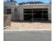Unfinished home with two-car garage being built and scaffolding at 10266 Rosemont Hills St, Las Vegas, NV 89141