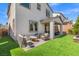 Enjoy outdoor living on the backyard patio with lush artificial turf at 10776 Maltese Falcon Ave, Las Vegas, NV 89129