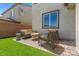 Inviting backyard with cozy seating on a paver patio, great for relaxing outdoors at 10776 Maltese Falcon Ave, Las Vegas, NV 89129