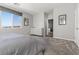 Bedroom featuring neutral decor, plush carpet and a bright window at 10776 Maltese Falcon Ave, Las Vegas, NV 89129